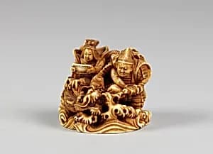 Netsuke of Two Seated Figures and a Dragon by Unknown Artist