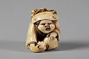 Netsuke of Woman and Monkey by Unknown Artist