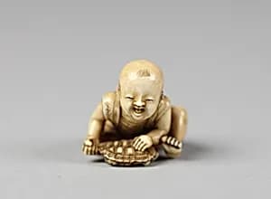 Netsuke of Child with a Turtle by Unknown Artist