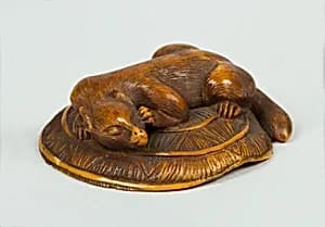 Netsuke of Animal on a Straw Mat under which is a Mouse by Unknown Artist