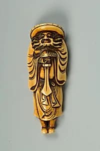 Netsuke of a Man Carrying a Sword by Unknown Artist