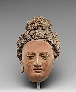 Head of a Buddha by Unknown Artist