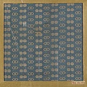 Textile fragment with repeating pattern of paired flowers and linked circles by Unknown Artist