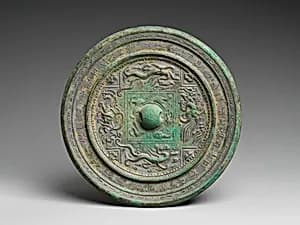 Mirror with symbols of the four cardinal directions by Unknown Artist