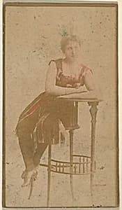 Seated actress leaning on table, from the Actresses series (N668) by Unknown Artist