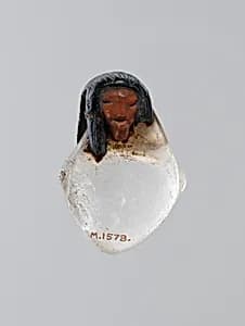 Amulet, Heart with human head by Unknown Artist