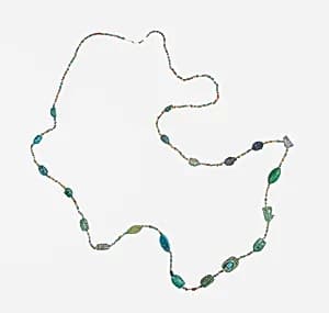 Amulets and string of beads by Unknown Artist