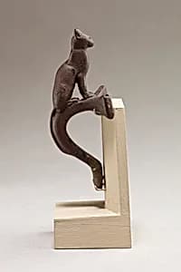 Cat on a handle by Unknown Artist