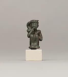 Crouching child god holding scepter by Unknown Artist