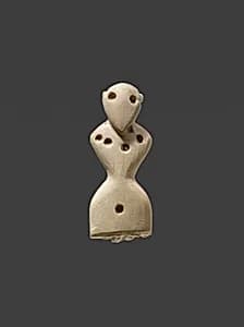 Female figurine wearing necklace by Unknown Artist