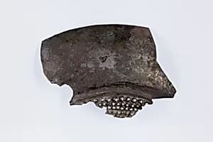 Fragment of a shallow strainer by Unknown Artist