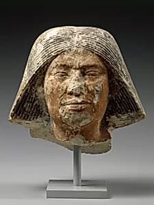 Head of a statue of an older man by Unknown Artist