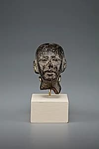 Head of male statue by Unknown Artist