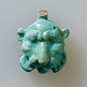 Lion head amulet by Unknown Artist