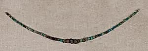 Necklace of striated beads by Unknown Artist