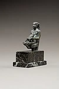Pediese kneeling and pouring libation by Unknown Artist