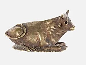Resting bovine figurine by Unknown Artist