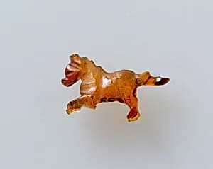 Running horse amulet by Unknown Artist
