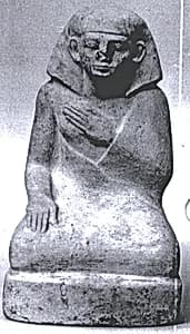 Statuette of a squatting man by Unknown Artist
