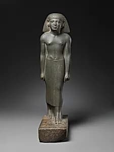 Statuette of a striding man by Unknown Artist
