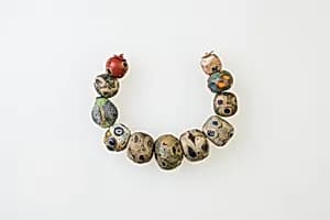 String of 11 Eye Beads by Unknown Artist