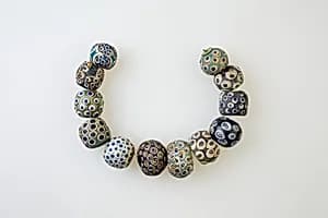 String of 12 Eye Beads by Unknown Artist