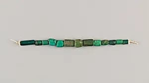 String of 13 beads by Unknown Artist