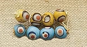 String of 4 Eyed Beads by Unknown Artist