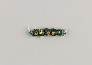 String of 5 eyed beads by Unknown Artist