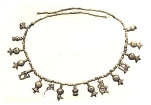 String of beads and amulets by Unknown Artist