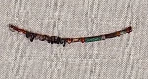 String of beads and amulets by Unknown Artist