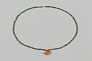 String of disk beads by Unknown Artist