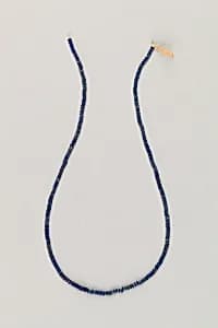 String of tiny disc beads by Unknown Artist