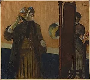 At the Milliner's by Edgar Degas
