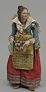 Girl carrying basket of onions by Unknown Artist