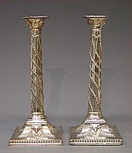Pair of candlesticks by Tudor and Leader