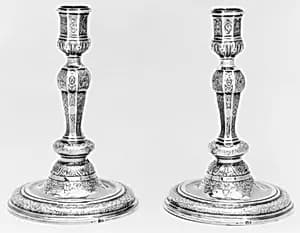 Pair of candlesticks by N.H. (?)