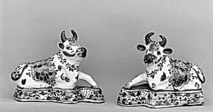 Pair of reclining cows by Unknown Artist