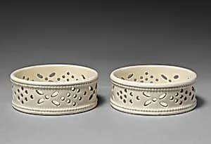 Pair of wine glass stands by Unknown Artist