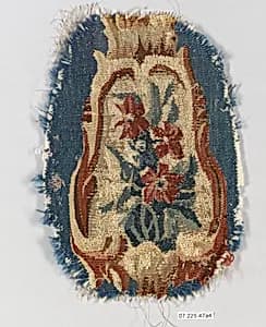 Rocaille cartouche with flowers by Beauvais