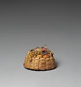 Round basket of fruit by Unknown Artist