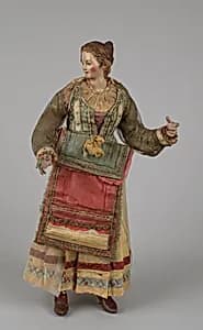 Standing woman in festival dress by Unknown Artist