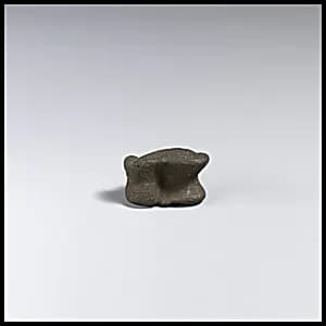 Bronze astragalus (knucklebone) by Unknown Artist