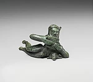 Bronze statuette of a reclining satyr by Unknown Artist