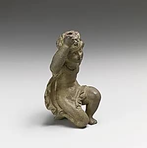 Bronze statuette of Eros kneeling by Unknown Artist
