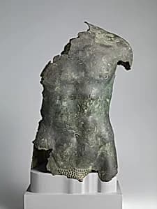 Bronze torso of a youth by Unknown Artist