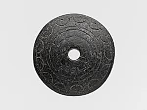 Chlorite spindle whorl by Unknown Artist