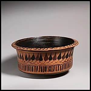 Deep terracotta bowl by Unknown Artist
