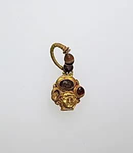 Earring with human face by Unknown Artist