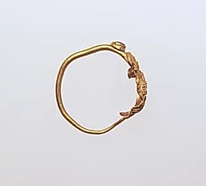 Earring with human figure by Unknown Artist